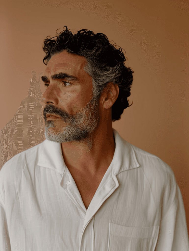 A person wearing the white shirt looking at the left